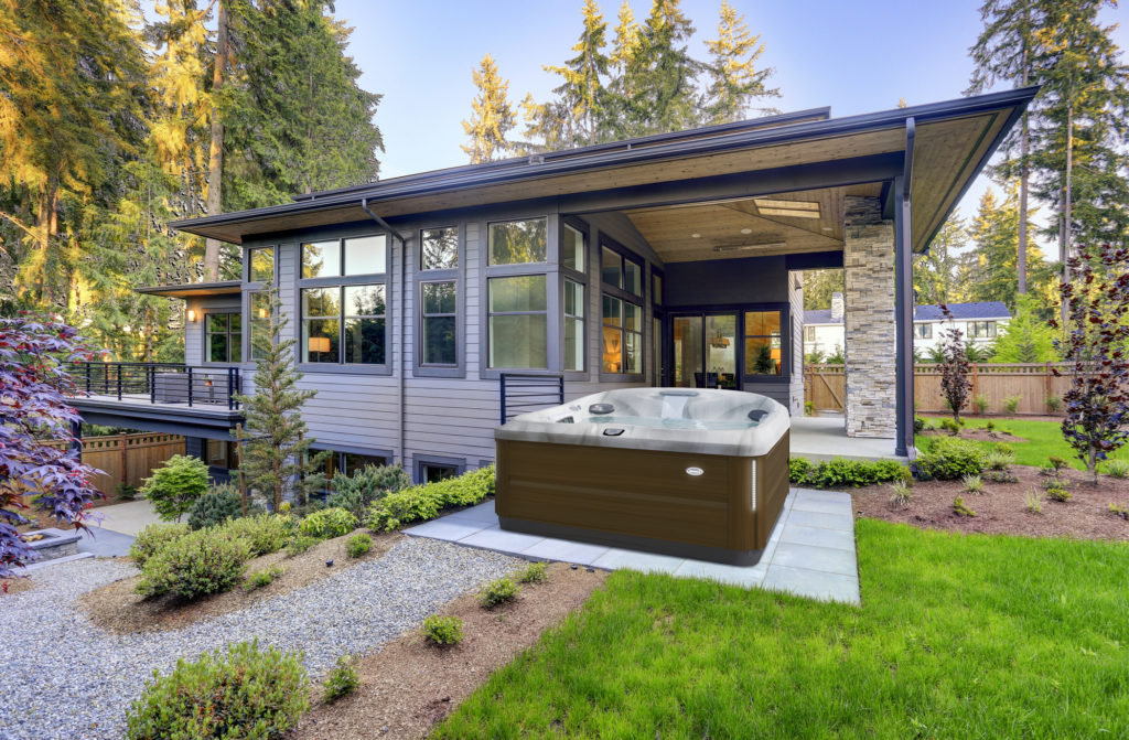 J-485 Jacuzzi Hot Tub installed in a beautiful backyard living space.